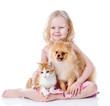 girl playing with pets - dog and cat. looking away. isolated 